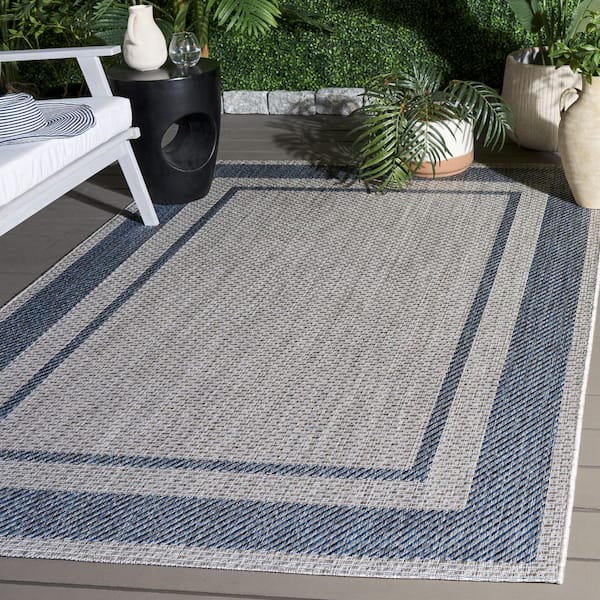 Courtyard 7 x 10 Gray/Navy Border Area Rug