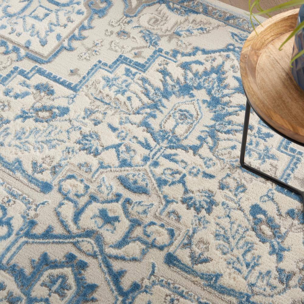 Ivory Blue Floral Synthetic 5' x 7' Rectangular Rug