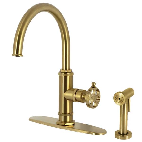 Kingston Brass Webb Deck Mount Single Handle Standard Kitchen Faucet with Sprayer in Brushed Brass