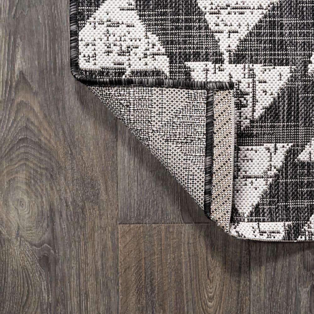 5' x 8' Black and Ivory Geometric Synthetic Area Rug