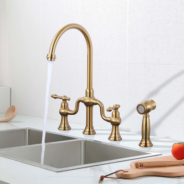 Gold Double Handle High-Arc Widespread Deck Mounted Kitchen Faucet With Side Spray in Brass