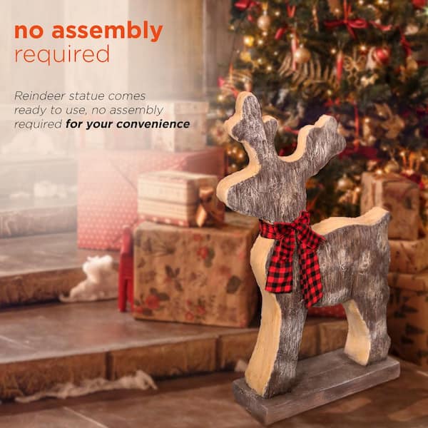 Premium Photo  Stylish christmas wrapped gifts reindeer toy paper stars on  rustic wood flat lay merry christmas