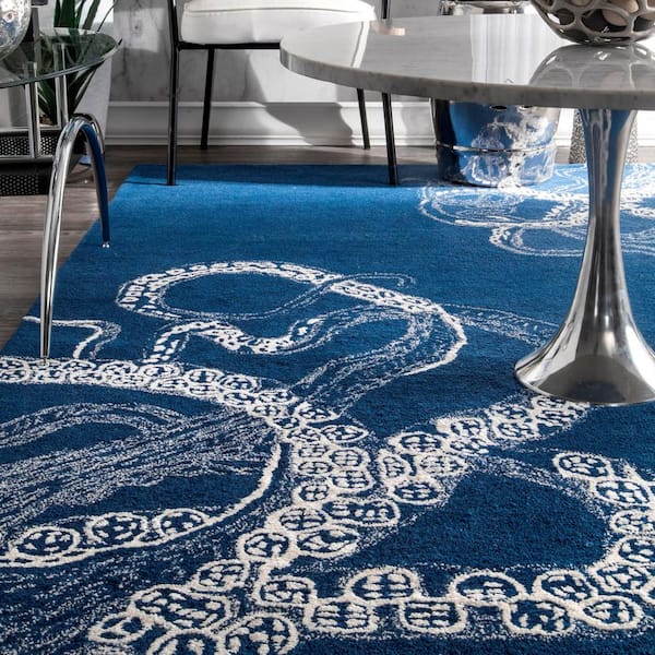 https://images.thdstatic.com/productImages/9b5bdbe7-759d-4d27-83e9-2fac47680194/svn/navy-nuloom-area-rugs-mtkt01g-76096-1d_600.jpg