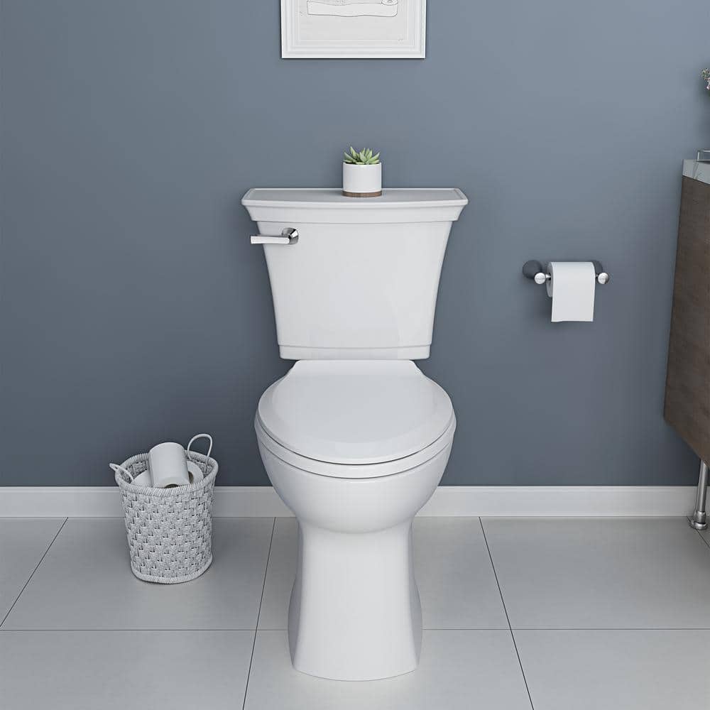https://images.thdstatic.com/productImages/9b62a7a5-3d90-4a9d-b419-326bd41ecbe0/svn/white-american-standard-two-piece-toilets-719aa101-020-64_1000.jpg