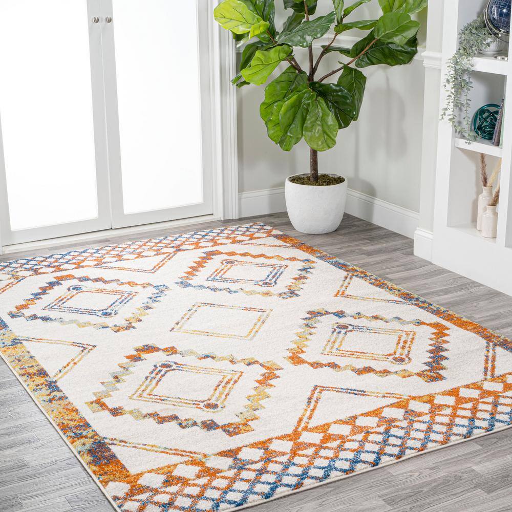 Ivory and Blue Geometric 8' x 10' Synthetic Area Rug