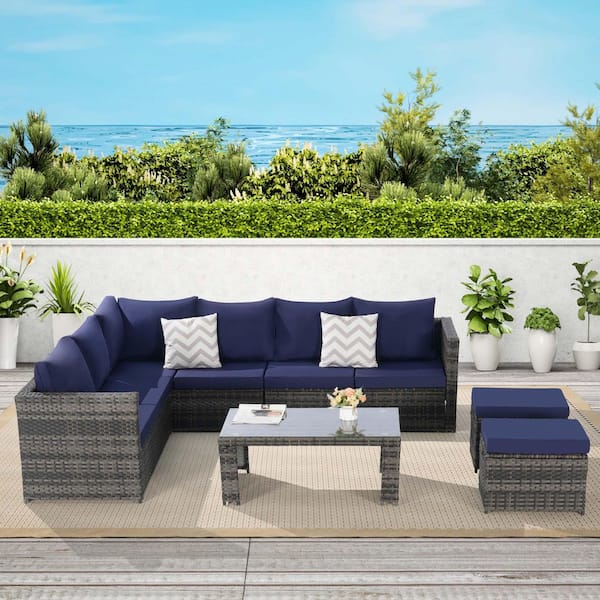 Zeus & Ruta 6-Piece Gray Wicker Outdoor Sectional Sofa Set with Dark Blue Cushions, Pillows and 1 Glass Table