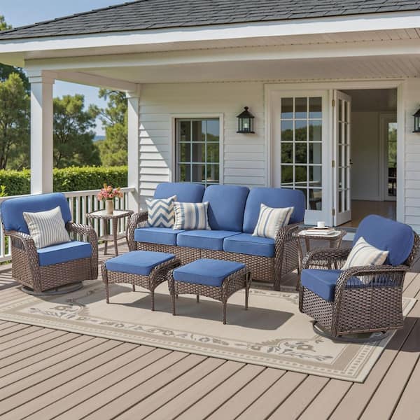 7-Piece Wicker Swivel Patio Conversation Set Including Sofa, Swivel Chairs, Footstools, and Table with Blue Cushions