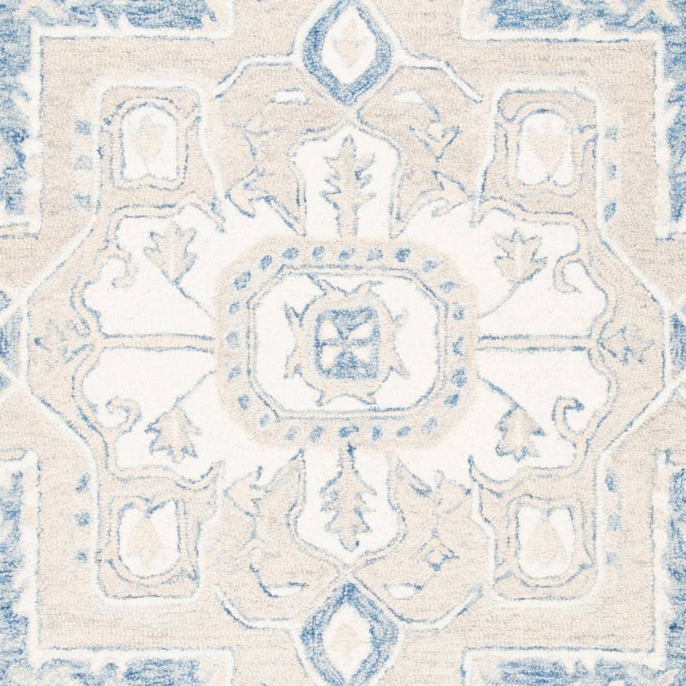 Handmade Blue and Ivory Wool 4' x 6' Tufted Area Rug
