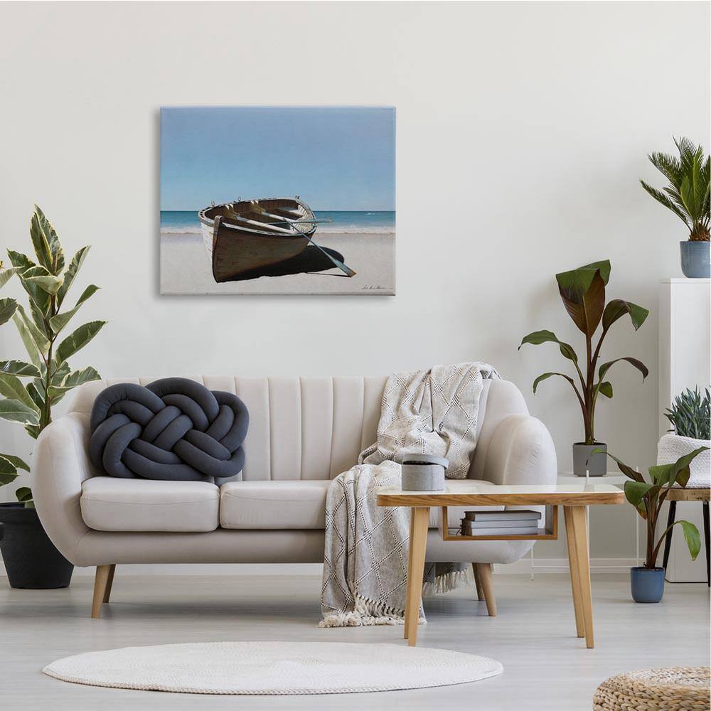 Large Beige and Blue Canvas Print of Row Boat on Shore