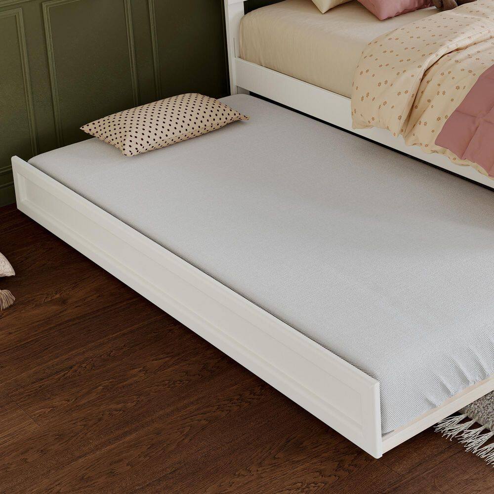 Flat lay of a white wood frame twin bed.