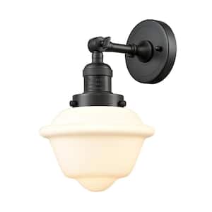 Oxford 7.5 in. 1-Light Oil Rubbed Bronze Wall Sconce with Matte White Glass Shade