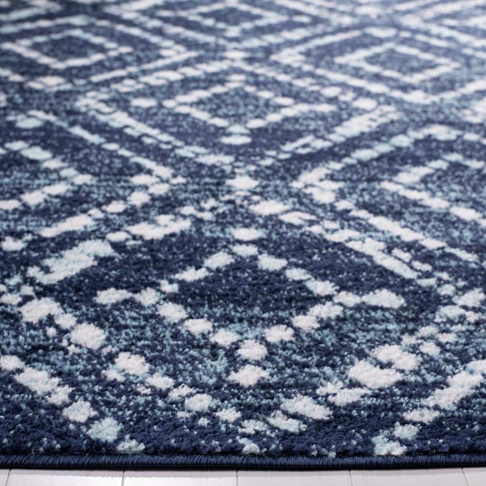 Navy and Ivory Geometric 4' x 6' Synthetic Area Rug