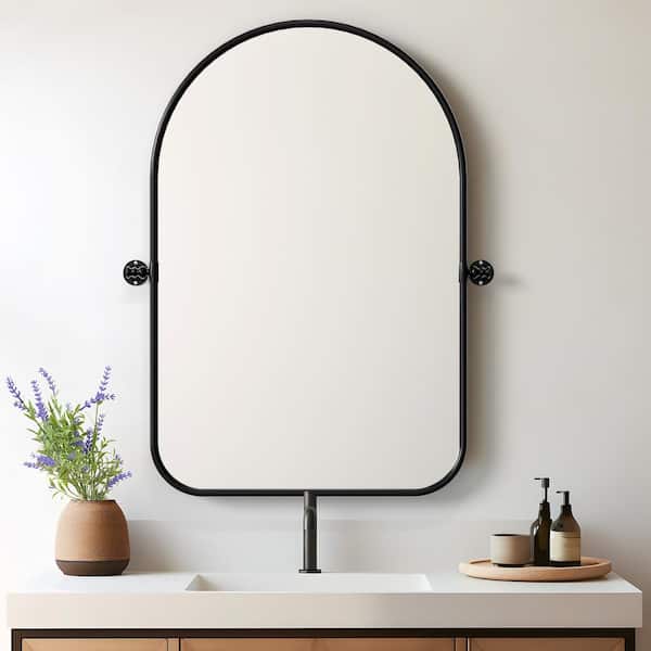 23 in. W x 31 in. H Arched Metal Framed Pivoted Bathroom Wall Vanity Mirror Round Corners in Black