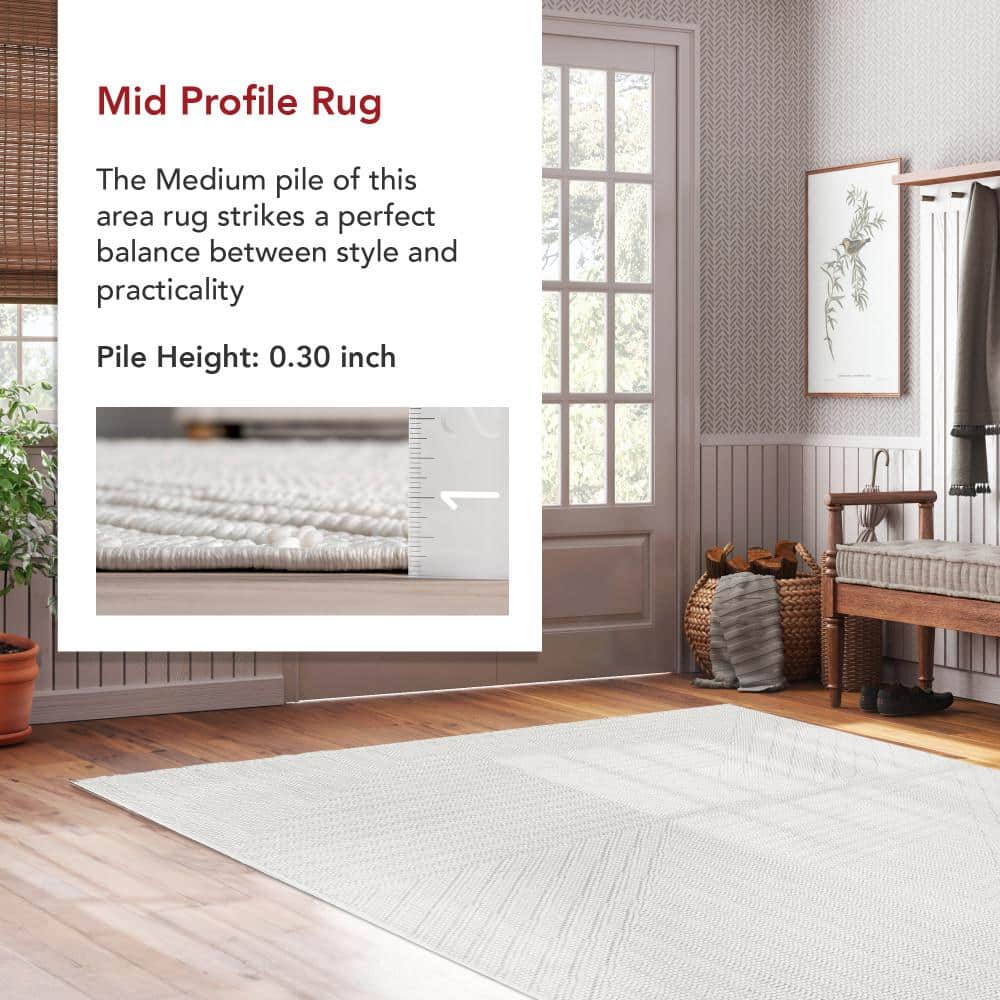 Makena Off-White Geometric Synthetic 6' 7" x 9' Area Rug