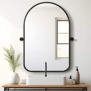24 in. W x 35 in. H Arched Metal Framed Pivoted Bathroom Wall Vanity Mirror Round Corners in Black