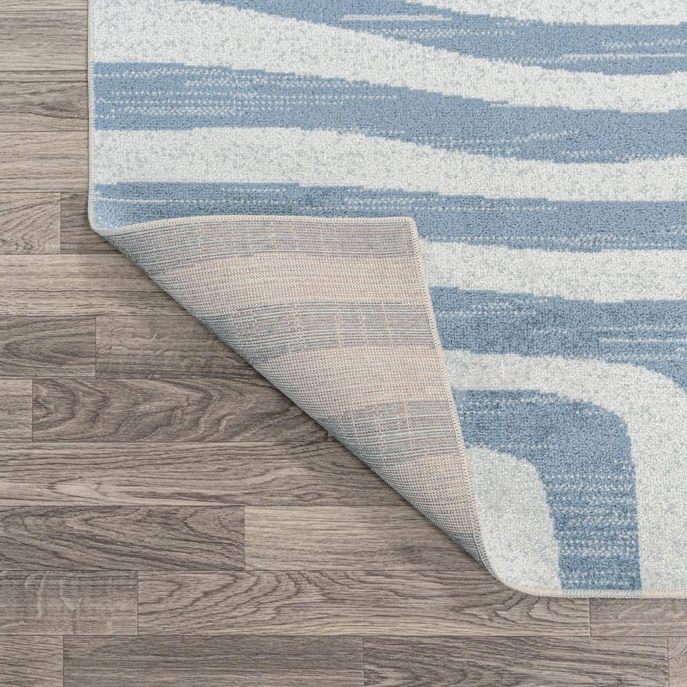 Blue and Cream Abstract Synthetic 4' x 6' Washable Area Rug