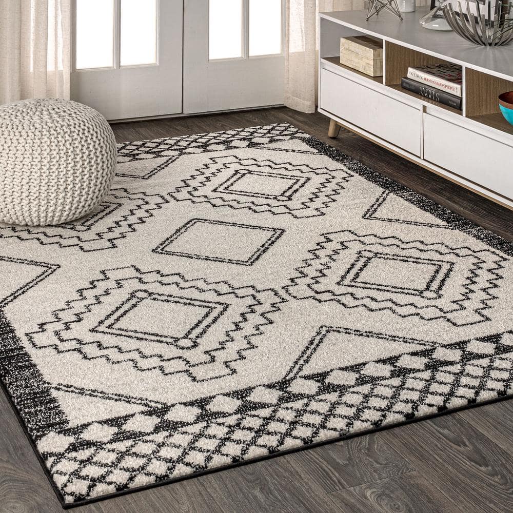 https://images.thdstatic.com/productImages/9cc842a1-8e5b-42a1-8470-9e1476530e5d/svn/cream-black-jonathan-y-area-rugs-moh200a-8-64_1000.jpg