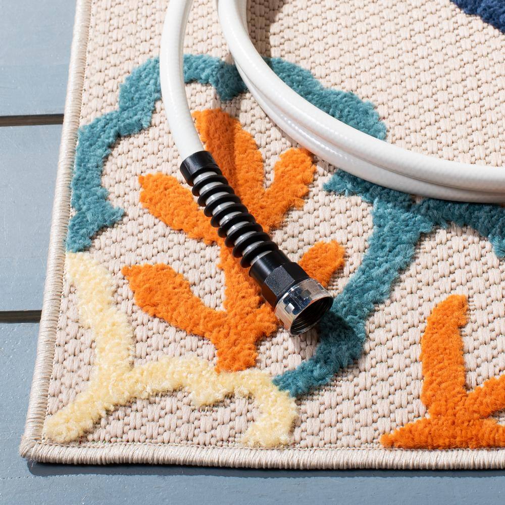Ivory and Orange Floral Synthetic 9' x 12' Area Rug