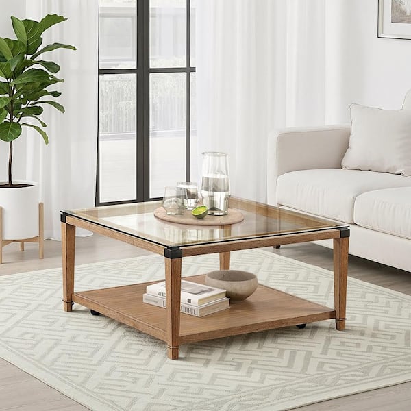 Shaffner 36 in. Brown Finish Wood Clear Tempered Glass Tabletop Cocktail Table with Casters