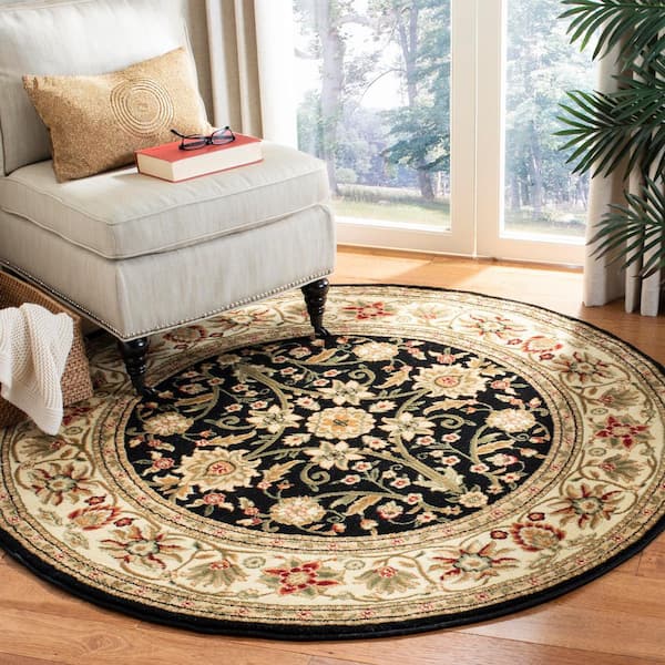 https://images.thdstatic.com/productImages/9d33d1bf-42da-4878-ac71-131895be2be7/svn/black-ivory-safavieh-area-rugs-lnh212a-5r-e1_600.jpg