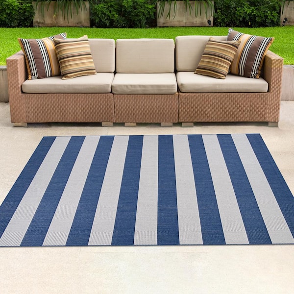 https://images.thdstatic.com/productImages/9d89548a-d9b4-4840-b321-9b0c0bed5318/svn/midnight-blue-ivory-couristan-outdoor-rugs-52298503053076t-e1_600.jpg