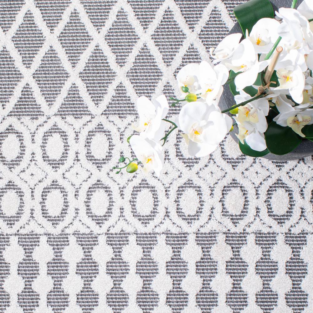Ivory and Grey Geometric 9' x 12' Synthetic Indoor/Outdoor Rug