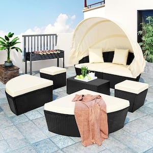 Black Wicker Outdoor Day Bed with Retractable Canopy and Beige Cushion