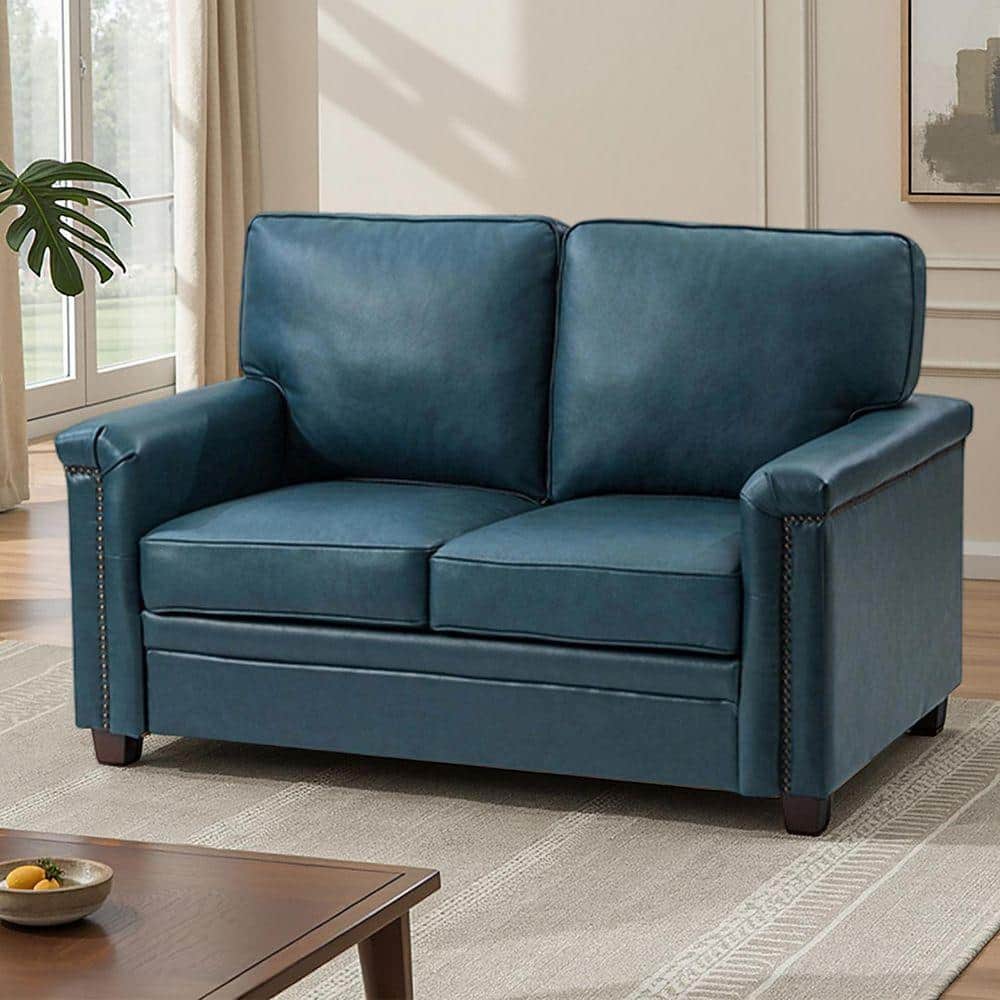 Turquoise leather two-seat sofa with rolled armrests and dark wooden legs.