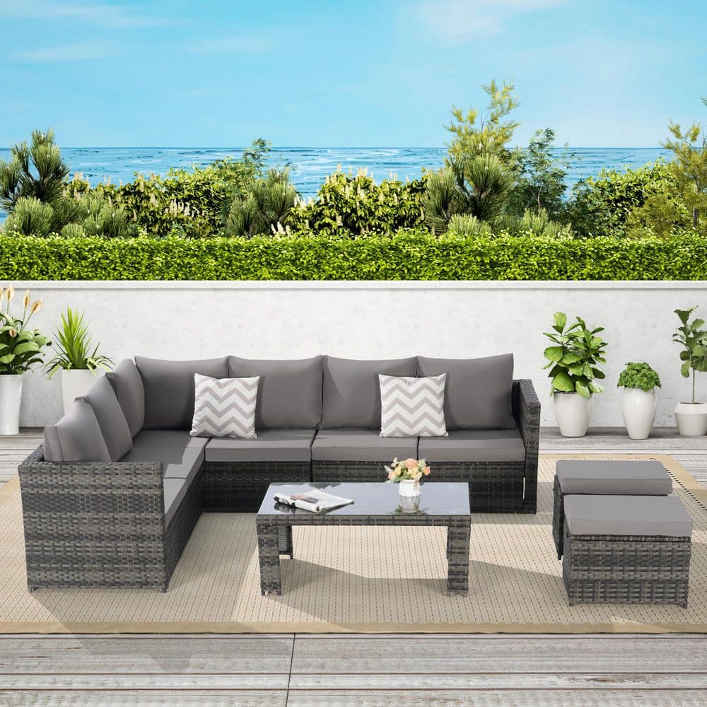 6-Piece Wicker Outdoor Sectional Set with Dark Gray Cushions and Glass Tabl