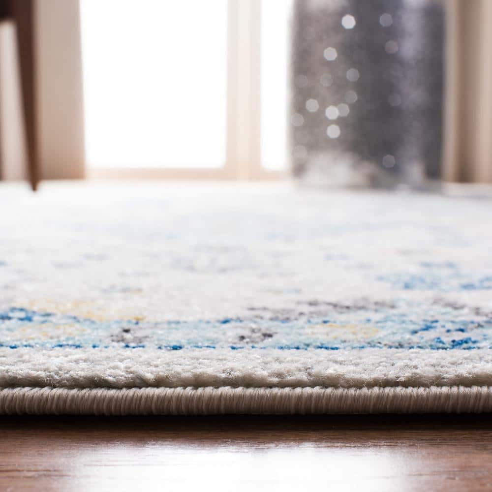 Ivory and Light Blue Floral Synthetic 9' x 12' Rectangular Area Rug