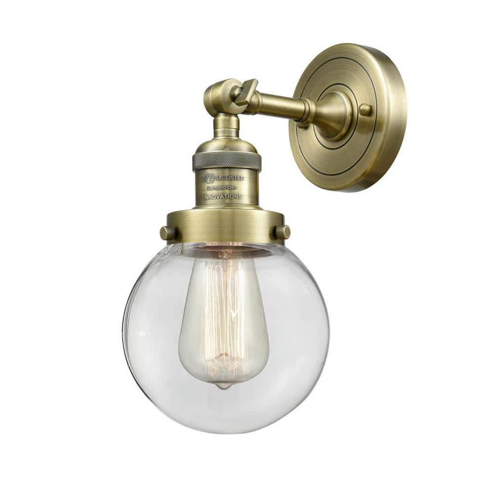 Beacon 1-Light Antique Brass, Clear Wall Sconce with Clear Glass Shade price history on PriceWatchPro