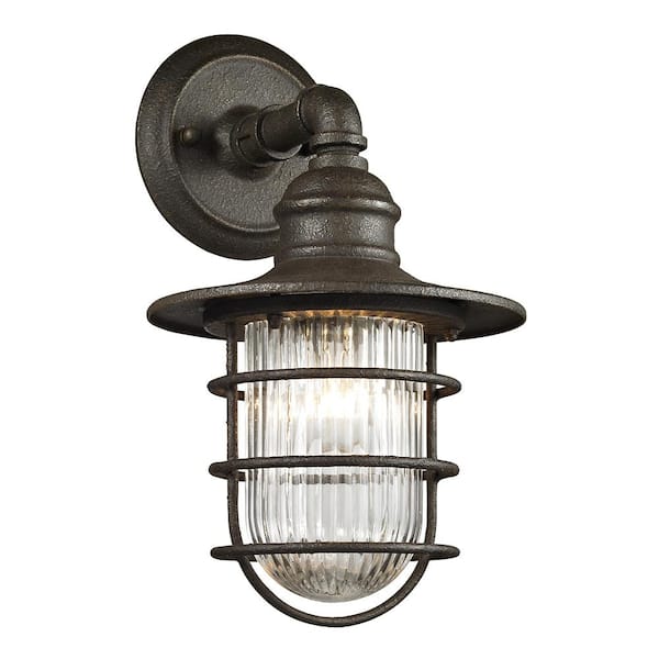 Fifth and Main Lighting Freeport 1-Light Centennial Rust Exterior Wall Mount Sconce with Glass Shade