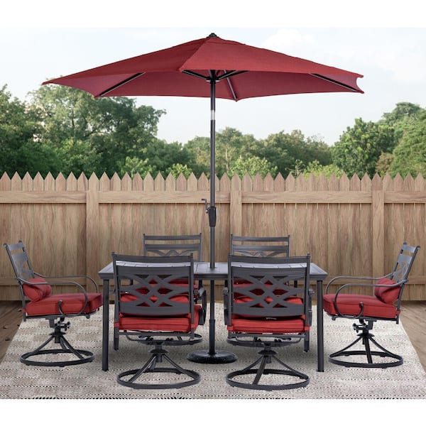 Hanover Montclair 7-Piece Steel Outdoor Dining Set with Chili Red Cushions, 6 Swivel Rockers, 40 in. x 66 in. Table and Umbrella