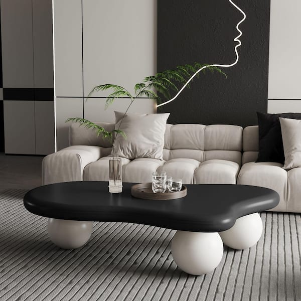Kellan 47.2 in. Modern Black Specialty Shaped MDF Wood Top Coffee Table with 3-White Ball Legs, Cloud Shaped