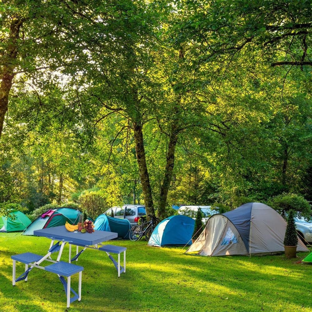 Blue plastic folding table set in a camping scene