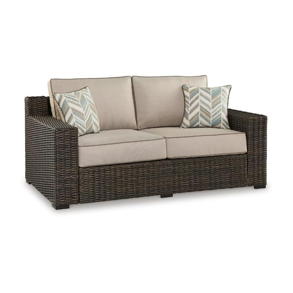 Benjara Brown Wicker Outdoor Loveseat with Beige Cushions