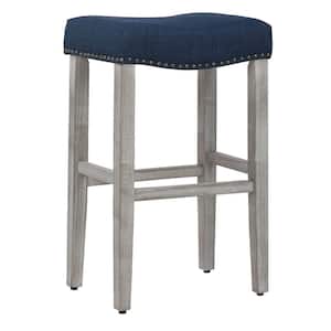 Jameson 29 in Bar Height Antique Gray Wood Backless Nailhead Barstool with Upholstered Navy Blue Linen Saddle Seat Stool