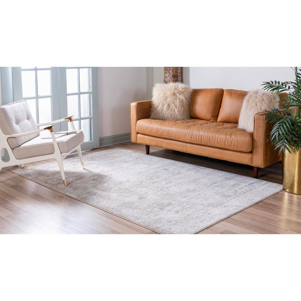 Ivory and Gray Geometric Synthetic 6' x 9' Area Rug