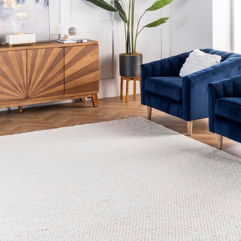 Handmade Off-White Braided Wool 5' x 8' Area Rug
