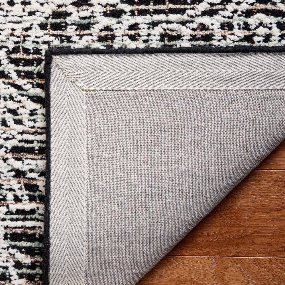 Handmade Black Wool 6' x 9' Tufted Area Rug