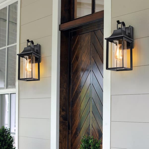 Decorators 14 in. Sand Black Farmhouse Cylinder Dusk to Dawn Outdoor Hardwired Cylinder Glass Sconce