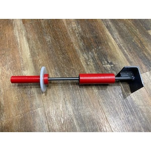The Lam-Hammer Professional 6500 is 17.5 in. long and 3 in. wide interlocking floor installation tool.