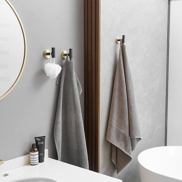 https://images.thdstatic.com/productImages/9f2d615c-70cb-4d2b-812a-29d4c096045a/svn/gold-balck-4-pcs-bwe-towel-hooks-a-91004-4-gbk-1-a0_600.jpg