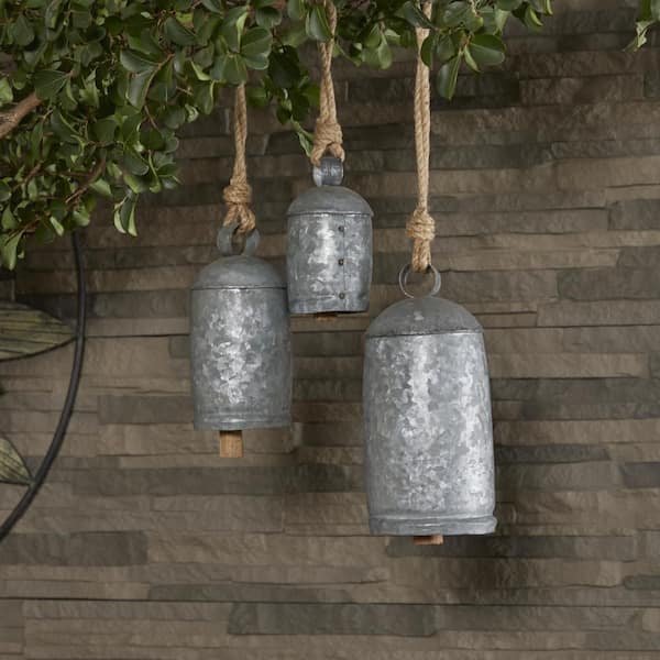 Litton Lane Gray Metal Tibetan Inspired Cylindrical Decorative Cow