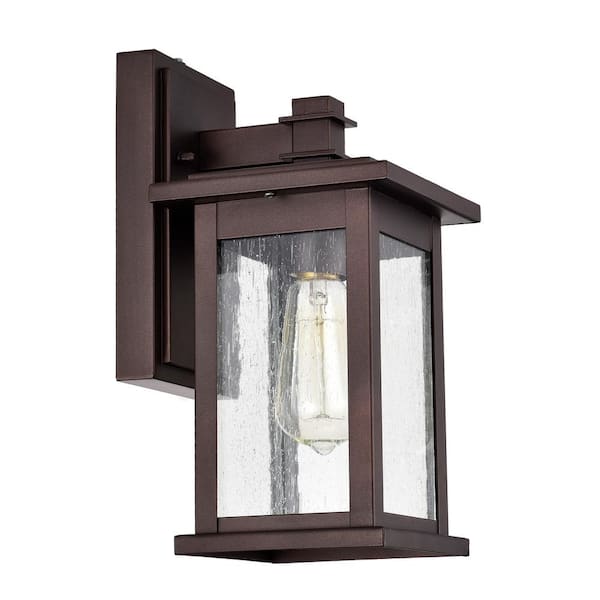 Tatahance 6 in. W 1-Light Oil Rubbed Bronze Sconce with Seeded Glass Shade and Dusk to Dawn Sensor