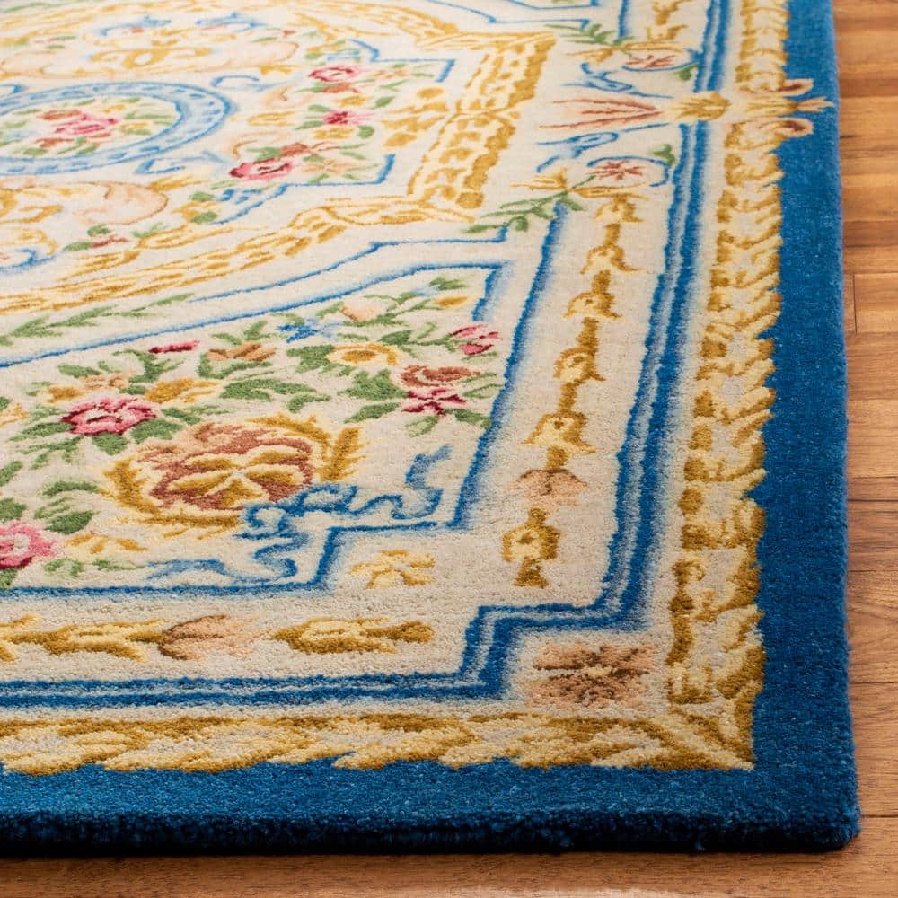 Handmade Blue and Ivory Wool 4' x 6' Tufted Area Rug