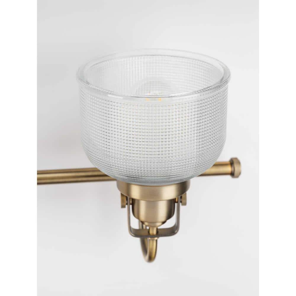 Vintage Brass Four-Light Bathroom Vanity Fixture with Prismatic Glass Shades