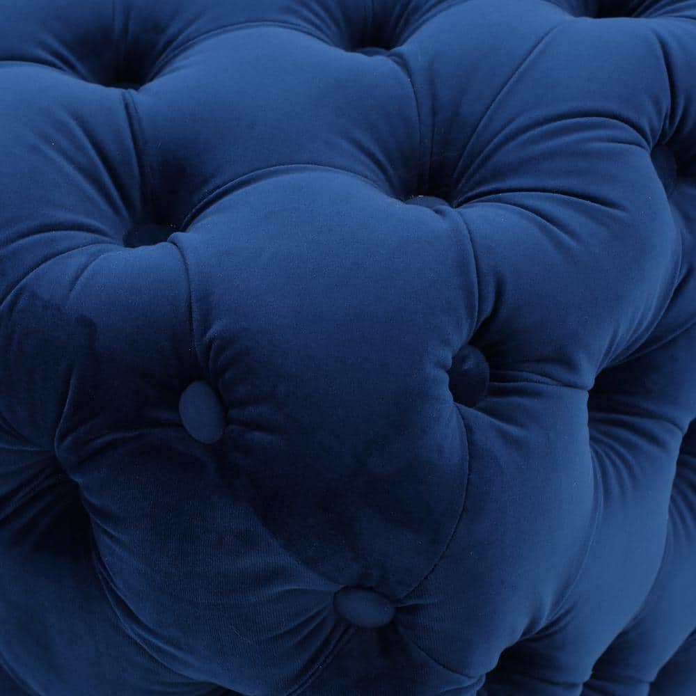 Close-up of navy blue velvet tufting.