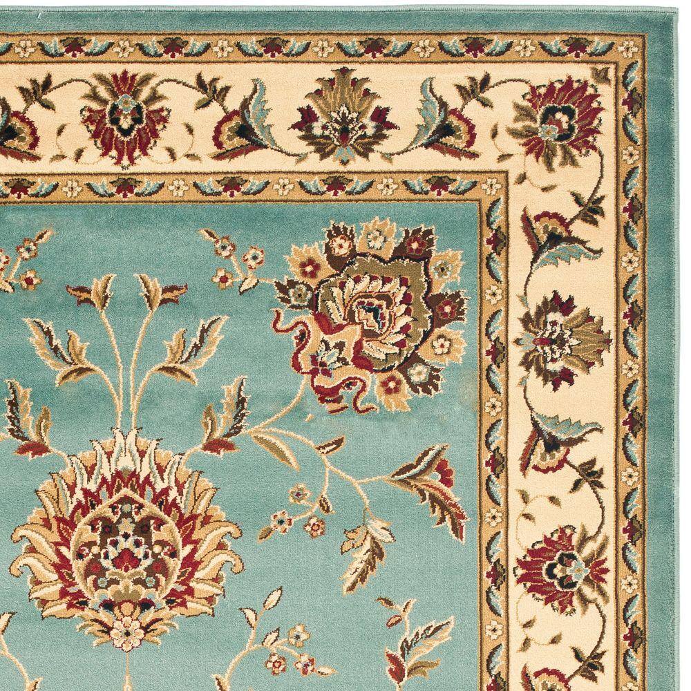 Blue and Ivory Floral Border Medium Pile Area Rug