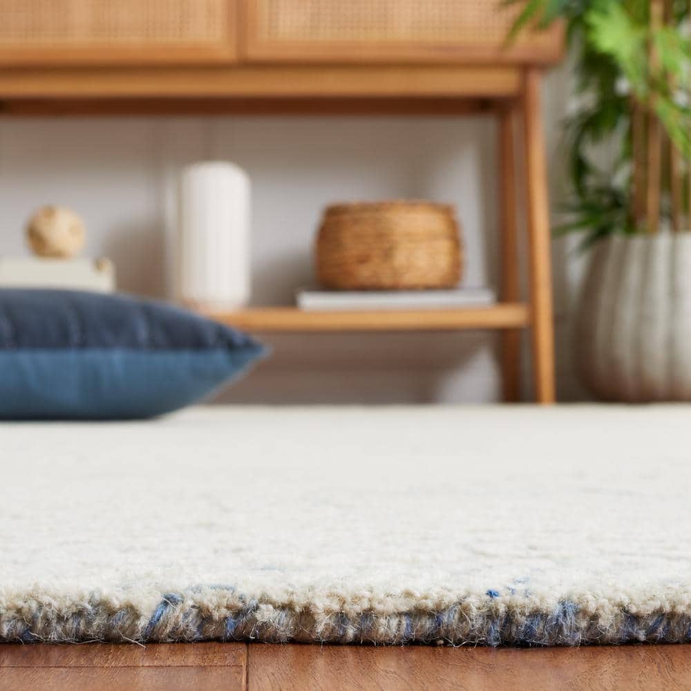 Handmade Blue Wool 5' x 8' Tufted Area Rug